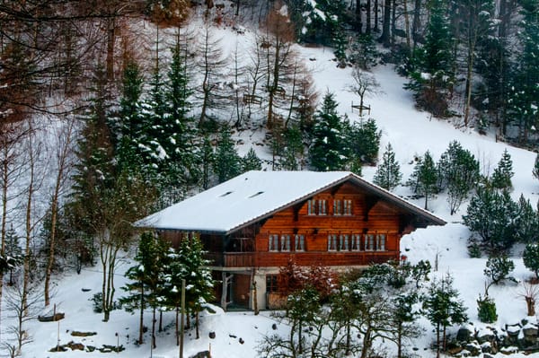 mountain cabin in snow